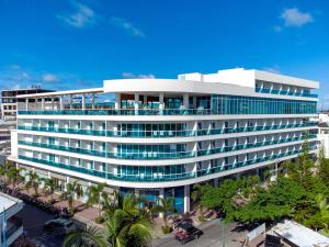 a large white building with a lot of windows at Aquamare Hotel in San Andrés