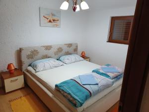 Posteľ alebo postele v izbe v ubytovaní Apartments Zuanović