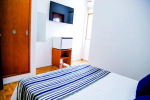 VOA Hotel Rezende客房内的一张或多张床位