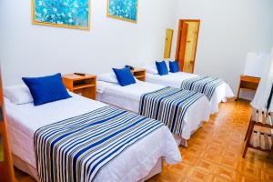 VOA Hotel Rezende客房内的一张或多张床位