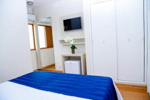 VOA Hotel Rezende客房内的一张或多张床位