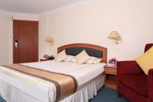 Postel nebo postele na pokoji v ubytování Hotel Sentosa + 9 fotografií