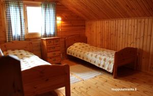 Postel nebo postele na pokoji v ubytování Cottage Nuppulanranta