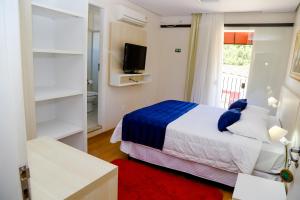 VOA Hotel Rezende客房内的一张或多张床位