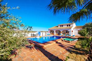 an image of a villa with a swimming pool at Finca Pepa - beautiful little house in pretty grounds with lovely views in Benissa in Teulada