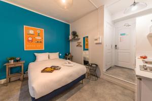 Tempat tidur dalam kamar di Apartments WS Hôtel de Ville - Le Marais