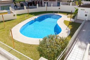 an overhead view of a swimming pool in a yard at Spacious 2bed family apartment in Puerto Marina in Benalmádena