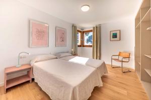 a bedroom with a large bed in a room at Seafront Villa Mar i Pins by Sealand Villas in Port de Pollensa +28 photos