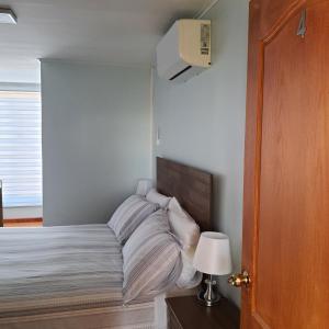 Rúm í herbergi á Hostal Ejecutivo
