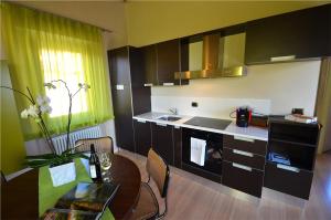 Kuchyň nebo kuchyňský kout v ubytování Casa Brina Suites