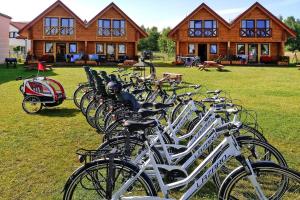 a row of bikes parked in front of a house at Semi-detached house, Niechorze in Niechorze