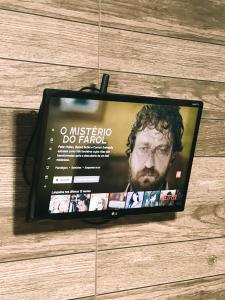 a tablet computer sitting on top of a wall at VIP Ponta Verde in Maceió