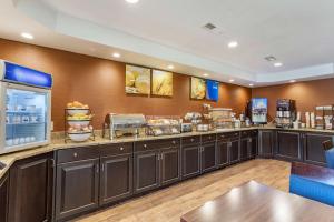 a fast food restaurant with a counter with food at Comfort Inn Biltmore West in Asheville
