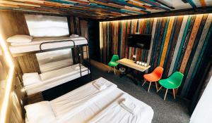 Postel nebo postele na pokoji v ubytování Loft Hotel