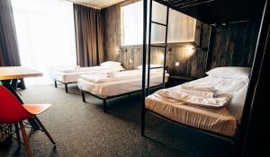 Postel nebo postele na pokoji v ubytování Loft Hotel