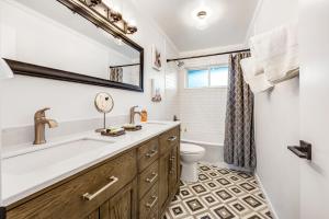 a bathroom with a tub and a sink and a toilet at Cold Drinks Hot Nights in Scottsdale +31 photos