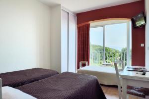 Postel nebo postele na pokoji v ubytování Hotel Alata