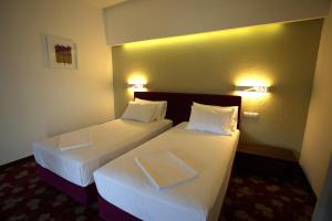 Voodi või voodid majutusasutuse Hotel Relax Craiova toas