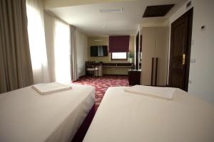 Voodi või voodid majutusasutuse Hotel Relax Craiova toas
