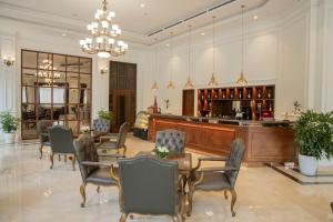 a dining room with a table and chairs at Pearl River Hotel in Hai Phong