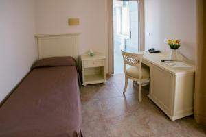Postel nebo postele na pokoji v ubytování Hotel le Muse
