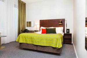 Säng eller sängar i ett rum på Elite Hotel Ideon, Lund