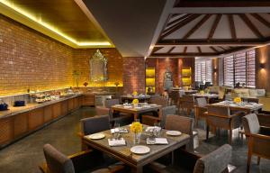 A restaurant or other place to eat at The Lalit Great Eastern Kolkata