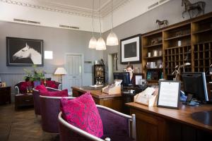 a room with chairs and a desk with a computer at Hotel du Vin Cheltenham in Cheltenham +49 photos