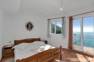 Posteľ alebo postele v izbe v ubytovaní Apartments Robinzon Nikola