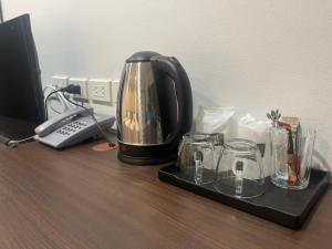 a coffee maker sitting on top of a desk at The Bliss Boutique Hotel in Ban Khuan Pling (1)