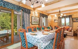 a dining room with a table and chairs at Awesome Home In Brod Na Kupi With Sauna in Brod na Kupi