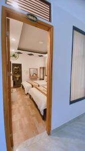 Postel nebo postele na pokoji v ubytování Minh Quan Hotel