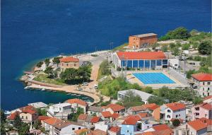 an aerial view of a town with a swimming pool at Nice Apartment In Sibenik With Wifi in Šibenik
