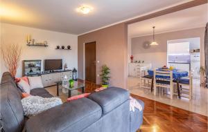 a living room with a couch and a table at Awesome Apartment In Fazana With 2 Bedrooms And Wifi in Fažana