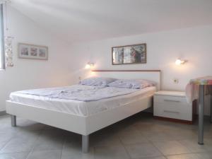 Een bed of bedden in een kamer bij Apartments Vanda