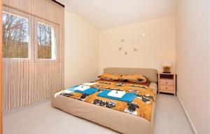 Posteľ alebo postele v izbe v ubytovaní Four-Bedroom Holiday Home In Lecevica