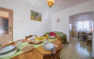A restaurant or other place to eat at Amazing Apartment In Valtura With Kitchen