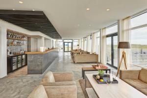 a living room with a couch and a table at Höfn - Berjaya Iceland Hotels in Höfn