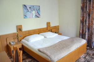 Posteľ alebo postele v izbe v ubytovaní Karat