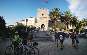 a group of people standing in front of a building at Beautiful Apartment In Blato With 1 Bedrooms And Wifi in Blato