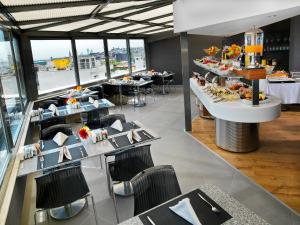 a dining room with tables and chairs and tablesktop at Misa Hotel in Istanbul