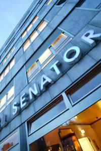 a sign on the side of a building at Hotel Senator München in Munich