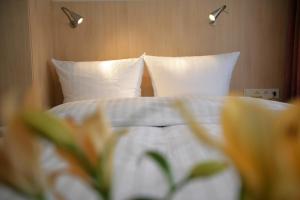 Postel nebo postele na pokoji v ubytování Hotel Senator München
