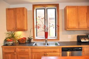 a kitchen with a sink and a window at Le Tierra del Fuego by HomeInMontreal in Montreal