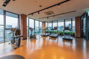 a gym with treadmills and exercise equipment in a building at Ceylonz Suites nr Pavilion & KLCC by YourSuperhost in Kuala Lumpur