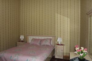 Cama o camas de una habitación en Ulli Hovli Hotel