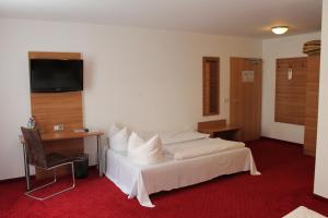 Кровать или кровати в номере Hotel Andra München
