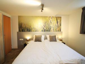 Ein Bett oder Betten in einem Zimmer der Unterkunft Modern Apartment in Sankt Margarethen im Lungau with Garden