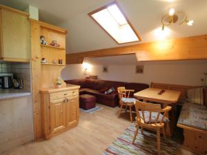 a living room with a couch and a table at Apartment in Embach Austria near ski area in Embach