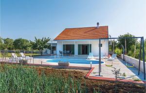 a house with a swimming pool in a yard at Nice Home In Lozovac With House A Panoramic View in Lozovac